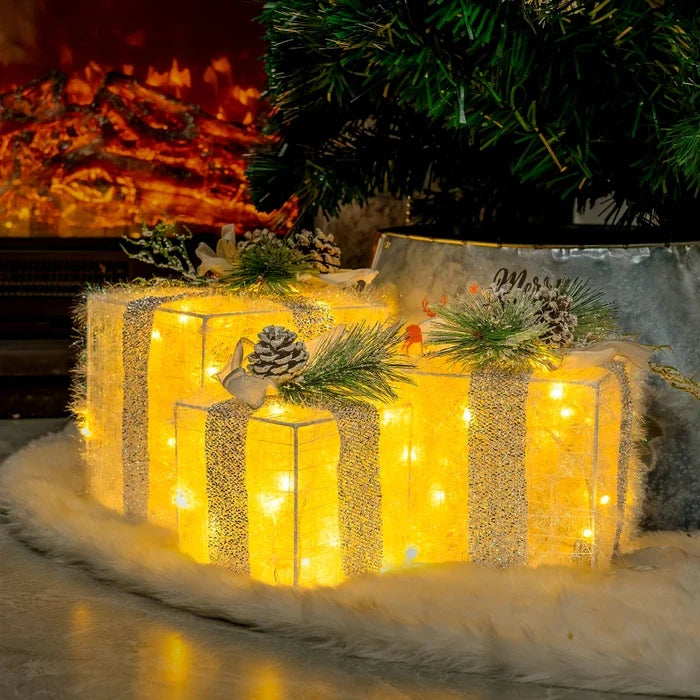 Leuchtende Weihnachtsgeschenkboxen – Set mit Tannenzapfen und Grün
