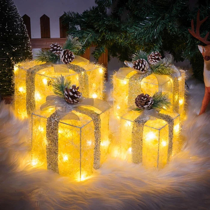 Leuchtende Weihnachtsgeschenkboxen – Set mit Tannenzapfen und Grün
