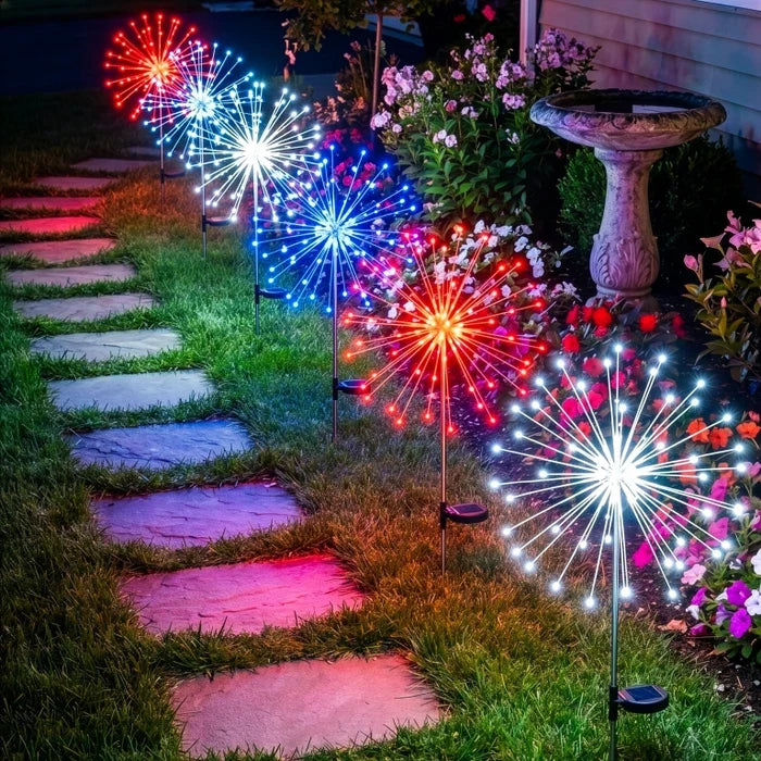Solarleuchten mit Erdspiess – funkelndes Licht in Rot, Weiss und Blau am Weg
