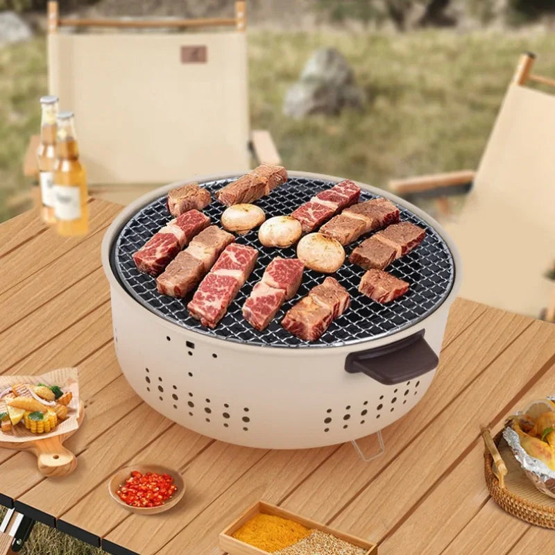 Tragbarer Holzkohlegrill aus Edelstahl und Gusseisen für Camping und Outdoor, kompakt und vielseitig 2